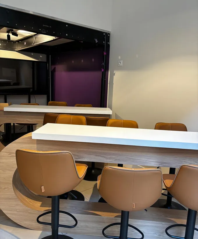 Meeting space in the vaulted cellars — soft lighting and exposed stonework